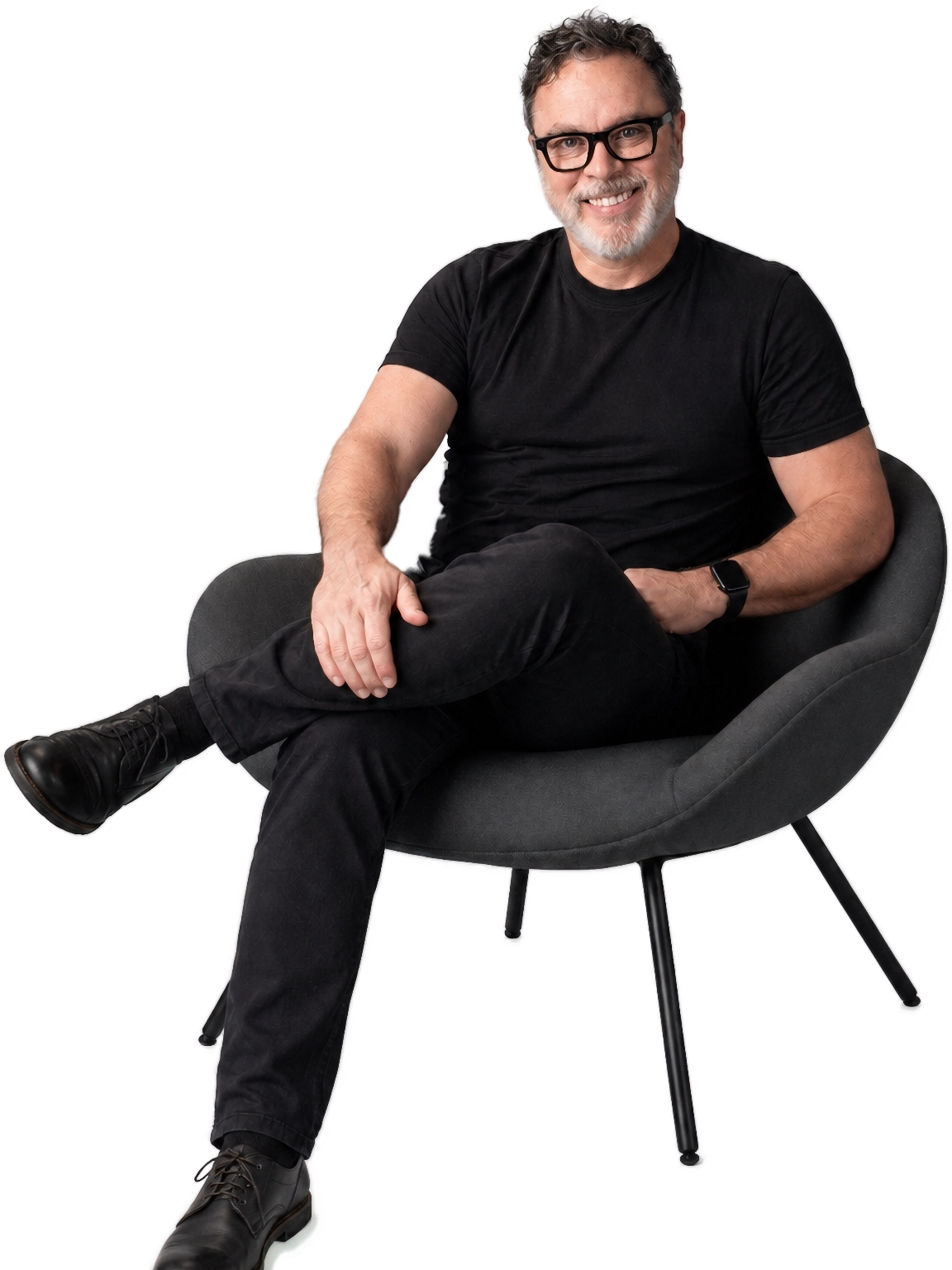 James seated in a black chair